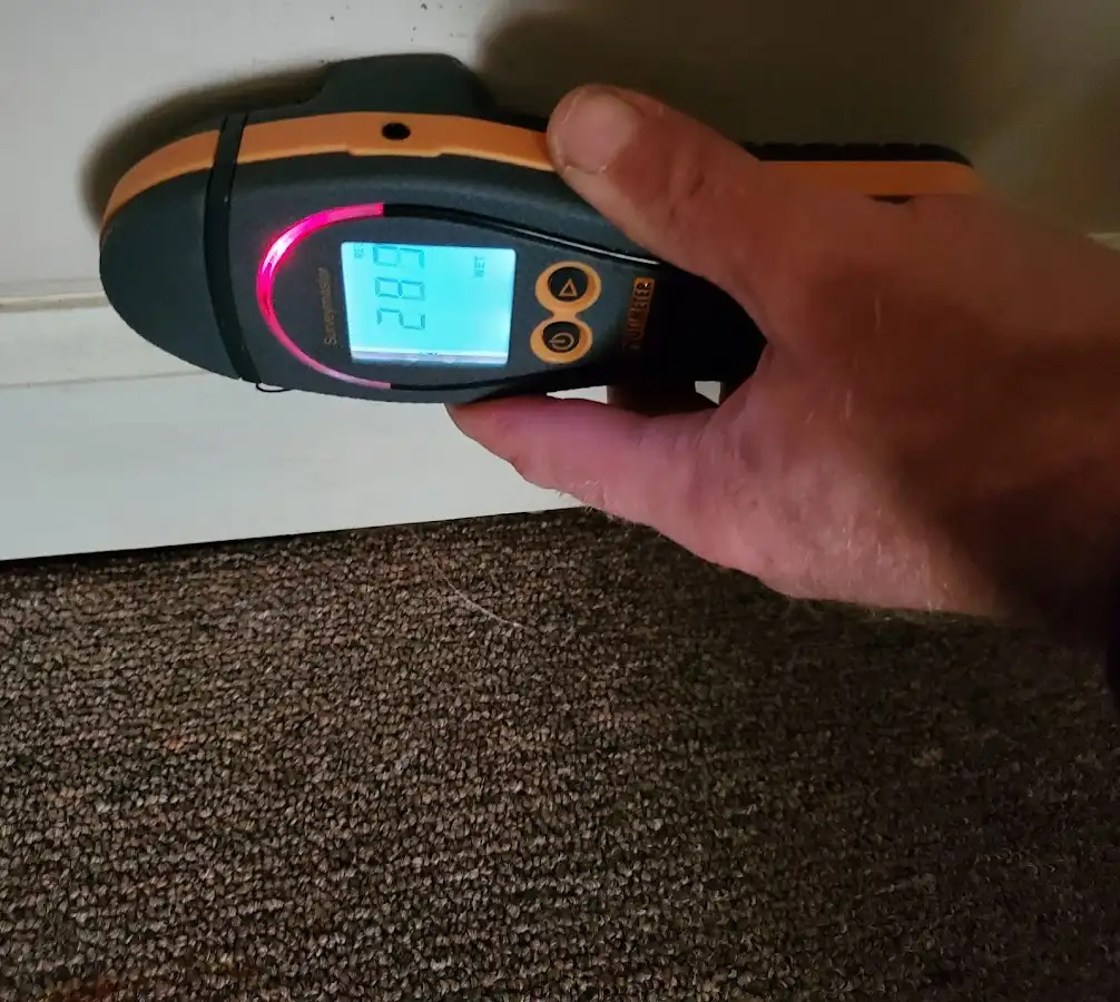 Moisture detection at baseboard during Storm Damage Restoration in Union City